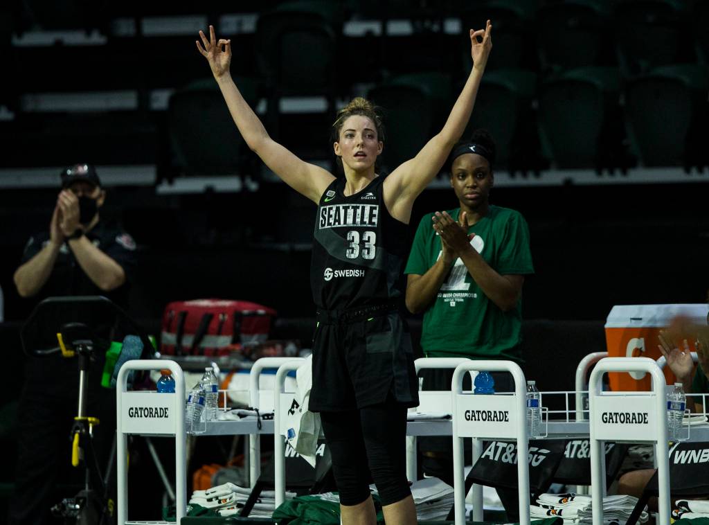 Seattle Storms Katie Lou Samuelson puts her hands up after Breanna Stewart makes a 3-point shot during a game against the Las Vegas Aces on May 15, 2021, in Everett. (Olivia Vanni / The Herald)