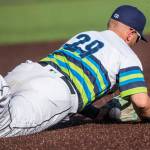 AquaSoxs Tyler Keenan dives for the ball during the game against the Dust Devils on Sunday, May 16, 2021 in Everett, Wash.