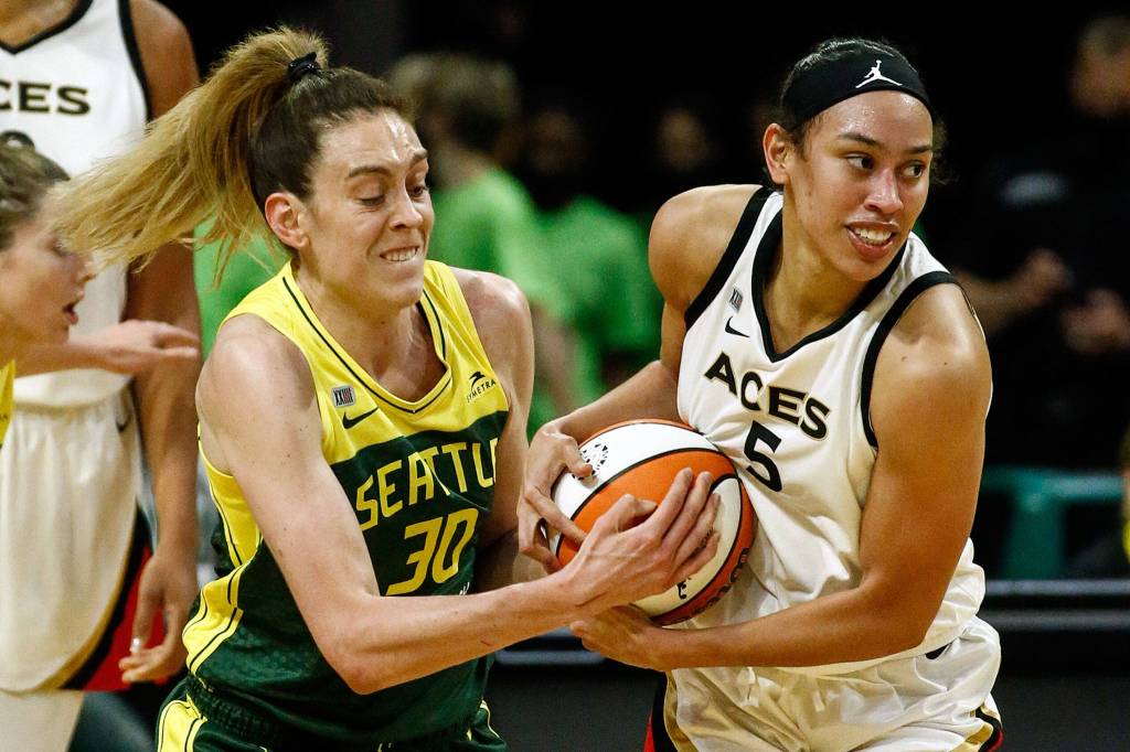 Seattles Breanna Stewart forces a jump ball with Las Vegas Dearica Hamby Tuesday night at the Angel of the Winds Arena in Everett on May 18, 2021. (Kevin Clark / The Herald)