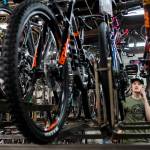 Gavin Buchanan checks inventory on a bike for a customer over the phone Friday at Tims Bike Shop in Everett. Owner Jay Hiester ordered bikes a year out, the first time hes had to do so in 21 years. (Olivia Vanni / The Herald)