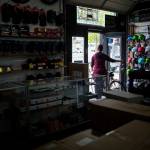 A customer walks out with their bike Friday after getting it serviced at Tims Bike Shop in Everett. The pandemic has been good, if stressful, for bike shops across the county. (Olivia Vanni / The Herald)
