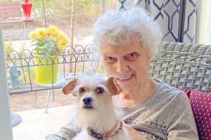Quail Park of Lynnwood resident Pat Webster and her pup, Roxie. With its comfortable, lodge-like aesthetic, Quail Park offers a safe, comfortable, pet-friendly environment.