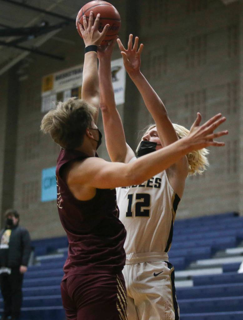 Lakewoods Blake Conyers blocks a shot by Arlingtons Trent Nobach during a game on May 19, 2021, in Arlington. (Andy Bronson / The Herald)