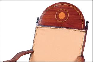 These Campeche chairs are made of mahogany with a small, circular inlay of a lighter wood. They were estimated to be worth $5,000 each. (Cowles Syndicate Inc.)