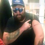 Daniel Scott, displaying a Proud Boys tattoo, in a photo from federal charging papers. (FBI)