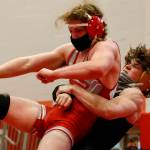 Lake Stevens Isiah Young (right) wrestles Stanwoods Mason Ferguson during a match on May 20, 2021, at Stanwood High School. Lake Stevens won 48-33. (Kevin Clark / The Herald)