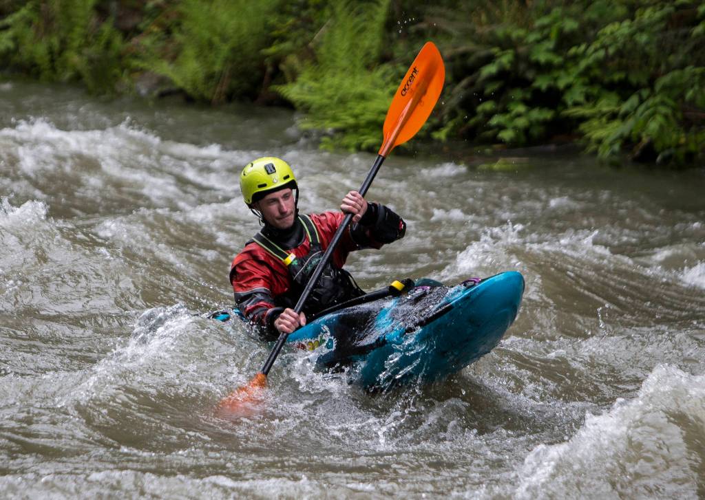 A kayaker paddles through rapids on the Sultan River. (Olivia Vanni / The Herald)