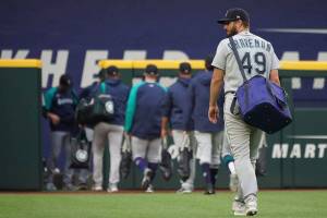 Seattle Mariners relief pitcher Kendall Graveman walks to the bullpen before the baseball game against the Texas Rangers Saturday, May 8, 2021, in Arlington, Texas. (AP Photo/Louis DeLuca)