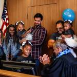 Arlingtons Avellaneda family joins Judge David Kurtz at his bench as Mayah, 6, strikes his gavel Nov. 22, 2019, National Adoption Day. (Dan Bates / Herald file)
