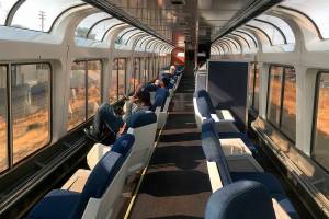 This Dec. 16, 2017 photo shows passengers lounging in the observation car of Amtrak's Coast Starlight on the way from Los Angeles to Seattle. The scenic 35-hour route travels from southern California to Seattle. (AP Photo/Nicole Evatt)