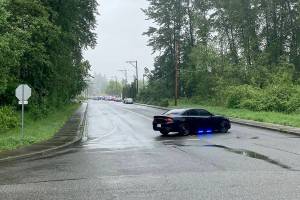 Police block a road while responding to a fatal shooting in Lake Stevens Monday morning. (Dakota Bair)