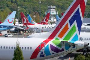 Boeing 737 Max airplanes sit parked in a storage lot, Monday, April 26, 2021, near Boeing Field in Seattle.  Boeing is paying $17 million and promising to take steps to fix production problems with its popular 737 jets. The Federal Aviation Administration said Thursday, May 27,  that the settlement covers the installation of unapproved sensors and other parts on some Boeing 737 models including NGs and the Max.   (AP Photo/Ted S. Warren)
