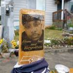 A sign that reads Gone but not forgotten is shown on a cross displayed May 27 at a memorial that has been established at the intersection in Tacoma, where Manuel Manny Ellis died on March 3, 2020, after he was restrained by police officers. (AP Photo/Ted S. Warren)