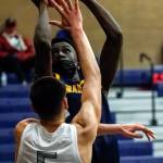 Mariners BJ Kolly attempts a shot over Glacier Peaks Tucker Molina during the third quarter of a game Thursday evening at Glacier Peak High School in Snohomish. Mariner won 64-36. (Kevin Clark / The Herald)