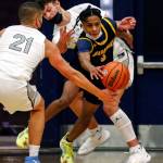 Mariners Jailin Johnson (right) chases down a loose ball through Glacier Peaks defense during a game Thursday evening at Glacier Peak High School in Snohomish. Mariner won 64-36. (Kevin Clark / The Herald)