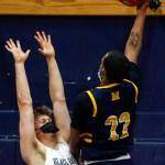 Mariners Naser Motley (right) attempts a shot with Glacier Peaks Tyson Willis defending during a game Thursday evening at Glacier Peak High School in Snohomish. Mariner won 64-36. (Kevin Clark / The Herald)