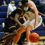 Mariners Tijan Saine (left) controls the ball with Glacier Peaks Torey Watkins defending during a game Thursday evening at Glacier Peak High School in Snohomish. Mariner won 64-36. (Kevin Clark / The Herald)