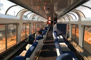 This Dec. 16, 2017 photo shows passengers lounging in the observation car of Amtrak's Coast Starlight on the way from Los Angeles to Seattle. The scenic 35-hour route travels from southern California to Seattle. (AP Photo/Nicole Evatt)