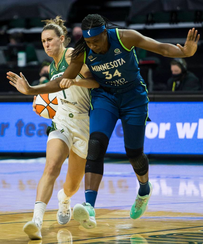 Seattle Storms Stephanie Talbot gets fouled by Minnesota Lynxs Sylvia Fowles during the game on Friday, May 28, 2021 in Everett, Wash. (Olivia Vanni / The Herald)
