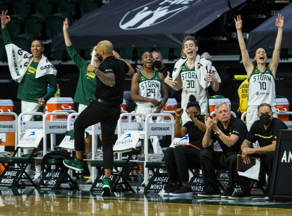 The Seattle Storm bench reacts to a three-point shot during the game against Minnesota on Friday, May 28, 2021 in Everett, Wash. (Olivia Vanni / The Herald)