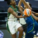 Seattle Storms Jewell Loyd gets fouled while she attempts a layup during the game against Minnesota on Friday, May 28, 2021 in Everett, Wash. (Olivia Vanni / The Herald)