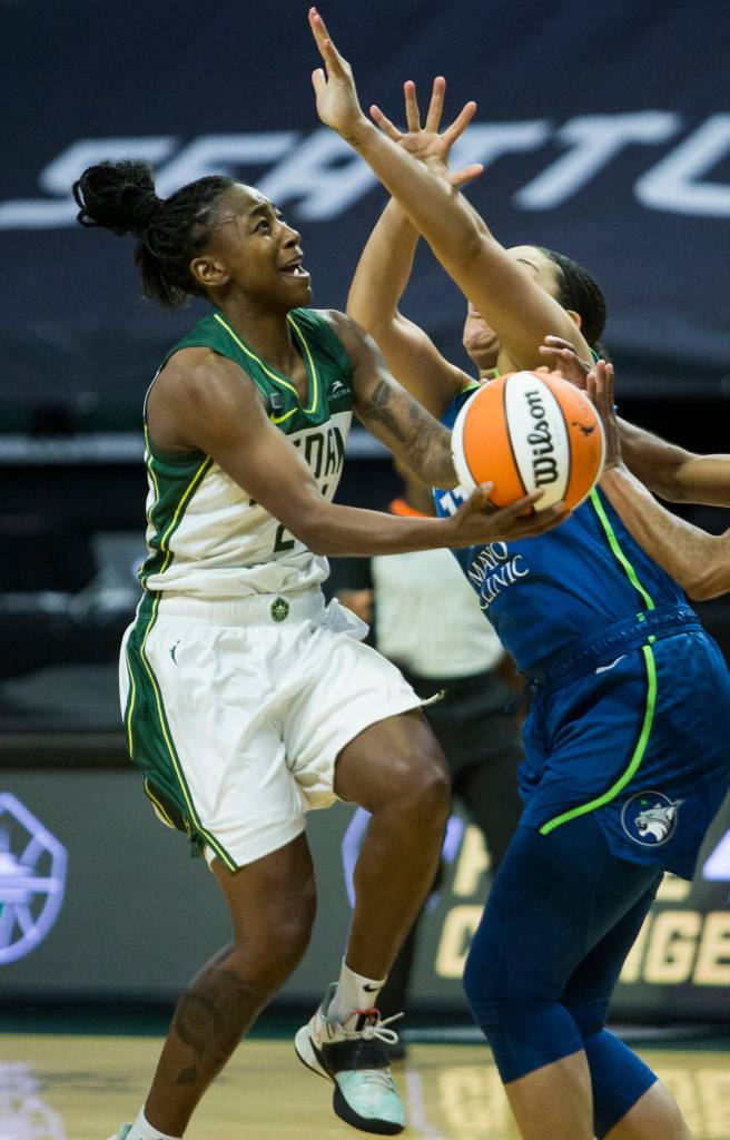 Seattle Storms Jewell Loyd gets fouled while she attempts a layup during the game against Minnesota on Friday, May 28, 2021 in Everett, Wash. (Olivia Vanni / The Herald)