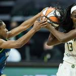 Minnesota Lynx's Crystal Dangerfield tries to steal the ball from Seattle Storm's Ezi Magbegor during the game on Friday, May 28, 2021 in Everett, Wash. (Olivia Vanni / The Herald)