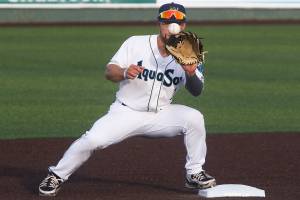 Aquasox's Kaden Polcovich keeps an eye on the ball and makes a double play as the Everett Aquasox beat the Tri-City Dust Devils in a home opening game at Funko Field on Tuesday, May 11, 2021 in Everett, Washington.  (Andy Bronson / The Herald)