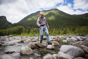 Bruce Kimball navigates his way across one of two river crossings he has to make to connect to Index-Galena Road to reach his cabin on Sunday, May 9, 2021 in Index, Wash.