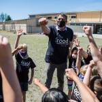 Jeff Thoreson does a cheer with his second-grade class before the start of their kickball game on his last in-person day of school Thursday in Snohomish. (Olivia Vanni / The Herald)