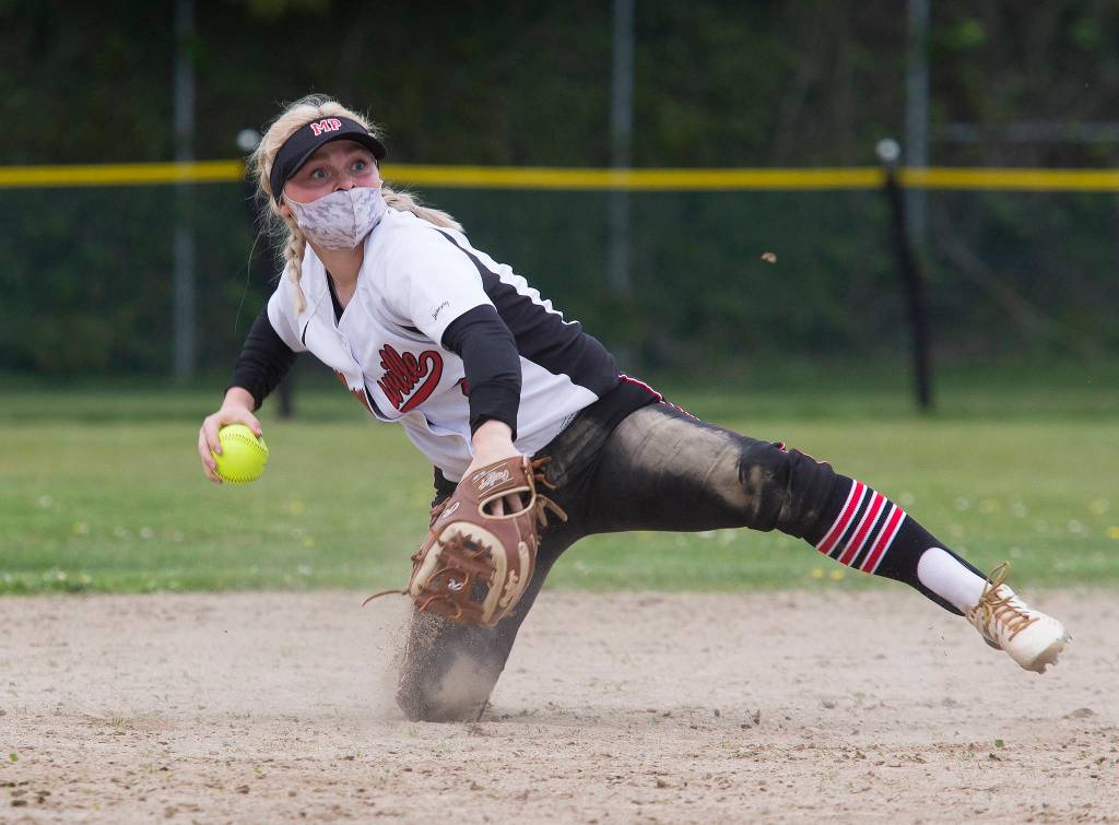 Marysville Pilchucks Cassidy Phelps makes a throw from one knee as undefeated during a game against Kamiak on April 28 in Mill Creek. (Andy Bronson / The Herald)
