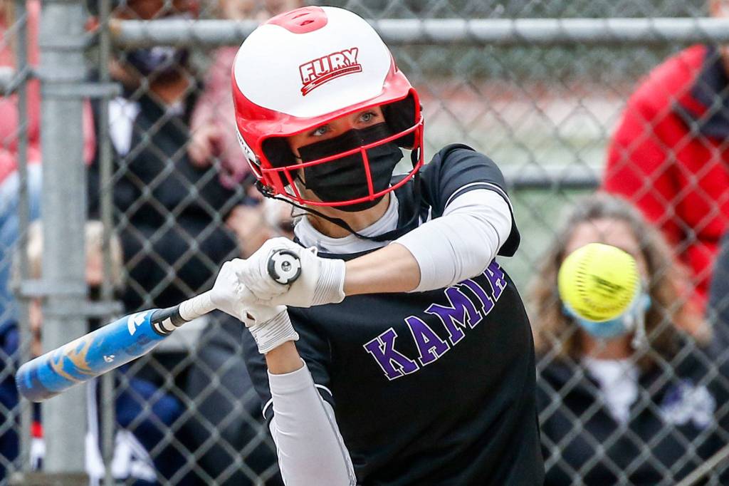 Kamiaks Kelci Carroll starts her swing during a game against Lakewood on April 30 at Kamiak High School. (Kevin Clark / The Herald)