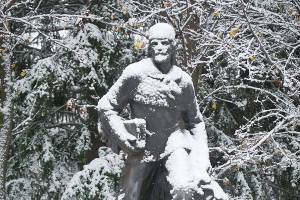 FILE - In this Dec. 6, 2016 file photo, a dusting of snow sits on the statue of Marcus Whitman in Walla Walla, Wash. For generations, Whitman has been viewed as an iconic figure from early Pacific Northwest history, a venerated Protestant missionary who was among 13 people killed by the Cayuse tribe near modern-day Walla Walla, Washington, in 1847. But this past year has seen the continued reappraisal of Whitman, whose actions are now viewed by many as imperialistic and destructive, and the Washington Legislature voted to remove a similar statue of Whitman from Statuary Hall in Washington, D.C. (Michael Lopez/Walla Walla Union-Bulletin via AP, File)
