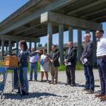 With other officials behind her, U.S. Rep. Suzan DelBene speaks at a news conference under the U.S. 2 trestle on Wednesday in Lake Stevens. (Andy Bronson / The Herald)