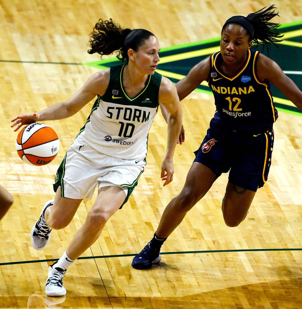 The Storms Sue Bird controls the ball with Indianas Lindsay Allen trailing Tuesday evening at Angel of the Winds Arena in Everett. (Kevin Clark / The Herald)
