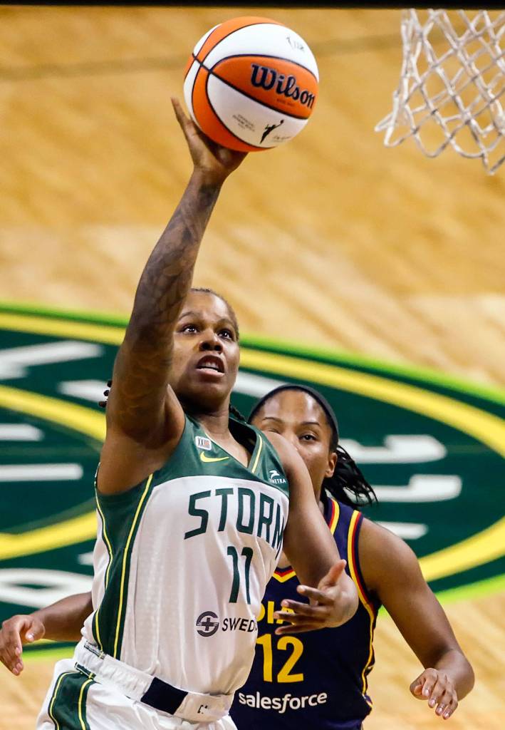 The Storms Epiphanny Prince attempts a layup with Indianas Lindsay Allen trailing Tuesday evening at Angel of the Winds Arena in Everett. (Kevin Clark / The Herald)