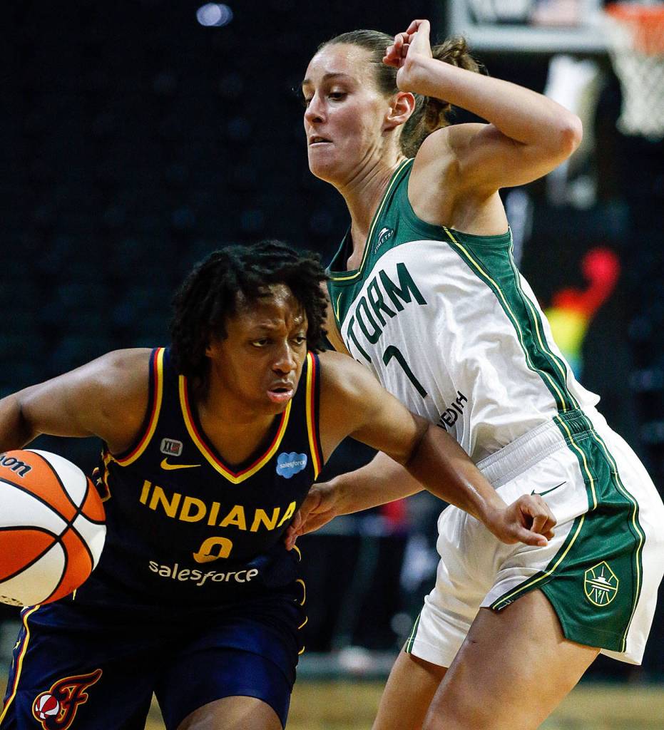 Indianas Kelsey Mitchell controls the ball with the Storms Stephanie Talbot defending Tuesday evening at Angel of the Winds Arena in Everett. (Kevin Clark / The Herald)