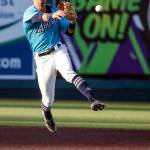 The AquaSoxs Patrick Frick throws to first base during a game against the Hops on Thursday evening at Funko Field in Everett. (Kevin Clark / The Herald)