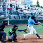 The AquaSoxs Miguel Perez hits a home run during a game against the Hops on Thursday evening at Funko Field in Everett. (Kevin Clark / The Herald)