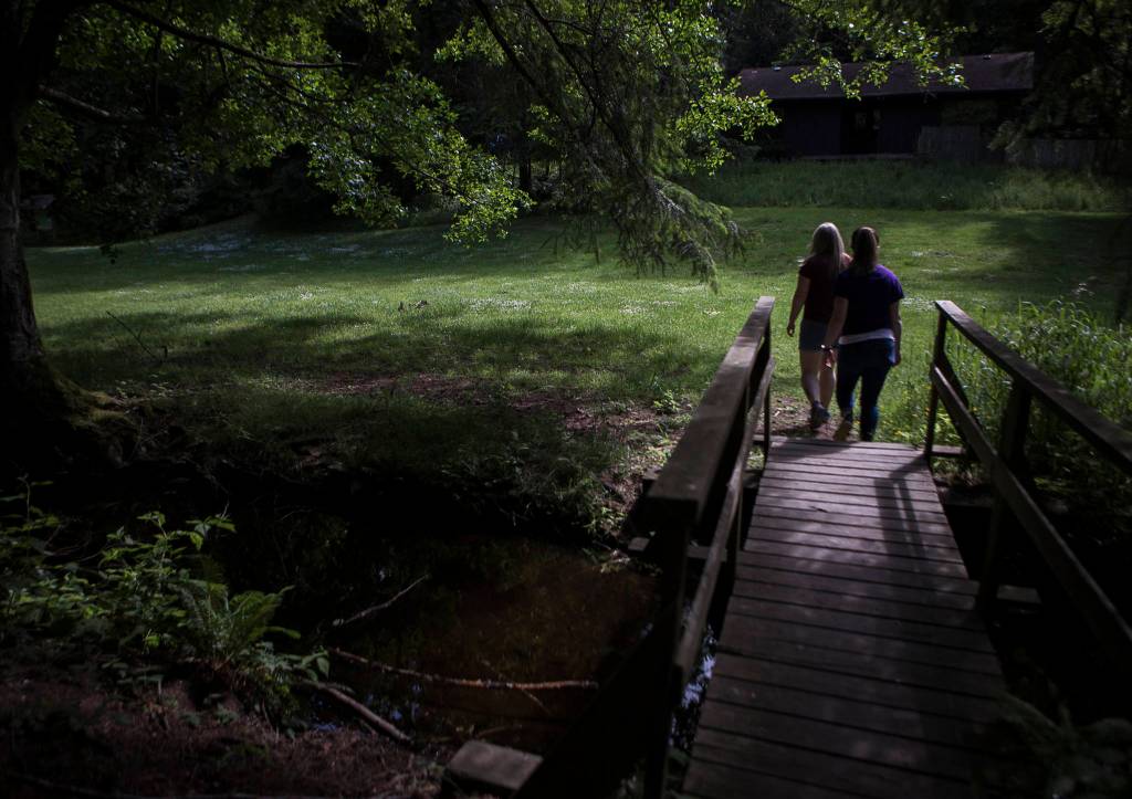 Camp staffers make their way to the meadow at Camp Killoqua. (Olivia Vanni / The Herald)