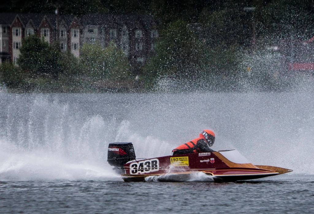 Torei McGregor navigates the first turn while being sprayed by another boats motor on Saturday, June 5, 2021 in Everett, Wash. (Olivia Vanni / The Herald)