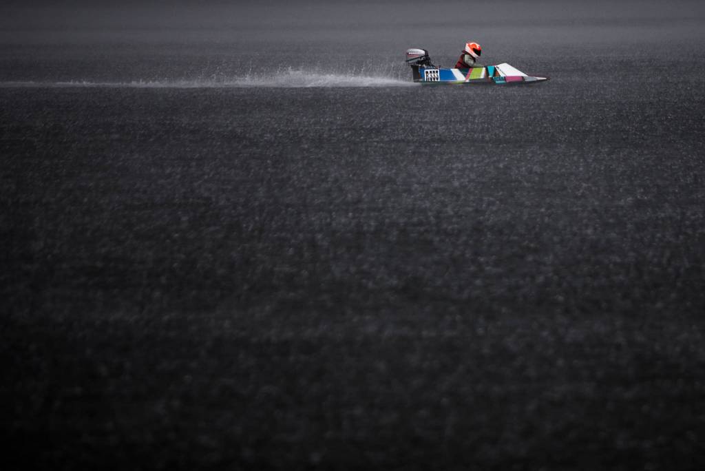 Kannon Cushing races his mini hydroplane through a rainstorm during the Seattle Outboard Associations Silver Lake Regatta on Saturday, June 5, 2021 in Everett, Wash. (Olivia Vanni / The Herald)
