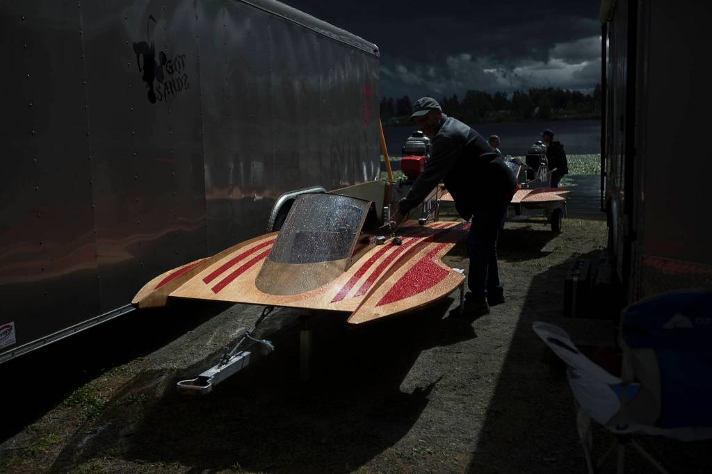 People prep their mini hydroplanes for racing before the start of the Silver Lake Regatta on Saturday, June 5, 2021 in Everett, Wash. (Olivia Vanni / The Herald)