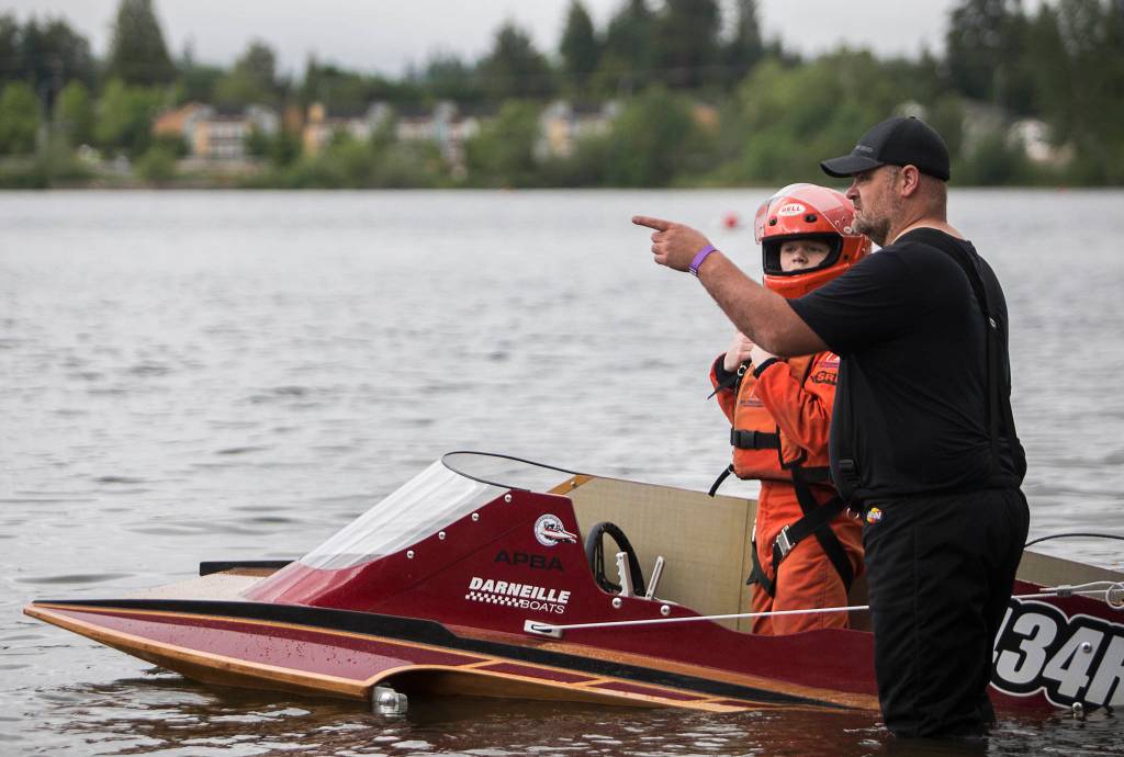 Trevor McGregor talks with his father before the start of his race on Saturday, June 5, 2021 in Everett, Wash. (Olivia Vanni / The Herald)