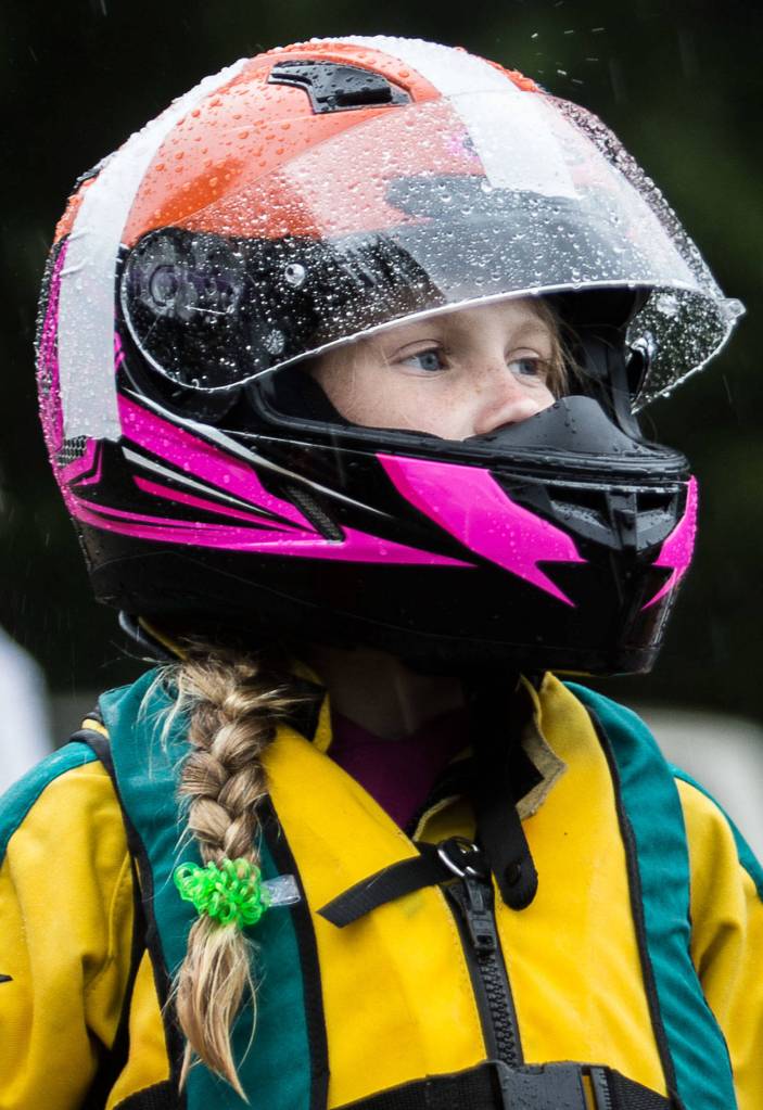 Harper Kelly-Moen watches as racers come into the pits on Saturday, June 5, 2021 in Everett, Wash. (Olivia Vanni / The Herald)