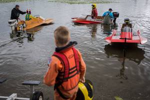 Mini hydroplane racers in the junior class races prepare to head out on the water at Sliver Lake on Saturday, June 5, 2021 in Everett, Wash. (Olivia Vanni / The Herald)