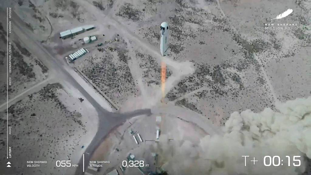 In this image from video, the New Shepard rocket lifts off during a test in West Texas on April 14. (Blue Origin via AP)