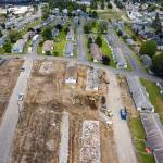 Construction crews demolish public housing at Baker Heights in Everetts Delta neighborhood on Tuesday. (Chuck Taylor / The Herald)