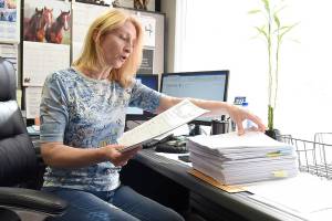 Galina Volchkova, the Volunteers of America Housing Director, discusses the volume of applications for rental assistance her office received Friday. (Katie Hayes / The Herald) 20210618