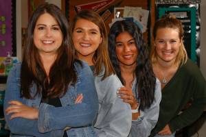 Taleah Burr (left right), Laurel Harrison, Caitlin Hitchner and Kelsey Jinneman-Fairbanks are four teachers at Challenger Elementary in Everett got Roman numeral '4' tattoos to represent their "Core 4" solidarity the day after their first year teaching in 2014.  (Kevin Clark / The Herald)